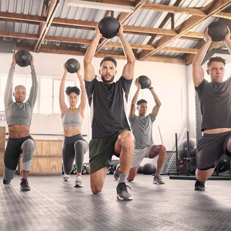 Athlete training with medicine ball